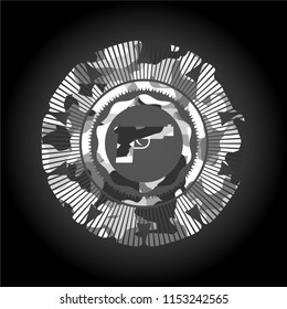 pistol icon inside grey camouflage emblem