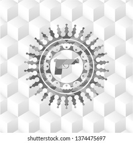 pistol icon inside grey emblem with geometric cube white background