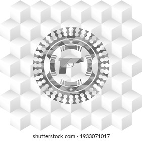 Pistolensymbol im grauen Emblem. Retro mit geometrischem, würfelweißem Hintergrund. 