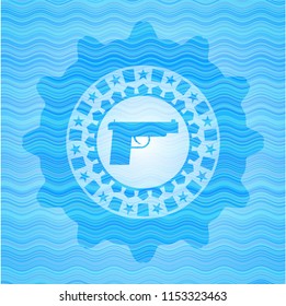 pistol icon inside light blue water wave badge background.