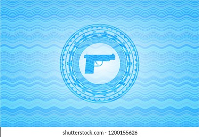 pistol icon inside light blue water style emblem.