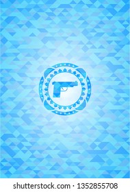 pistol icon inside light blue mosaic emblem