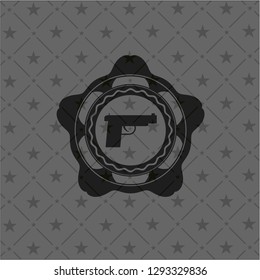 pistol icon inside realistic dark emblem
