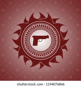 pistol icon inside realistic red emblem