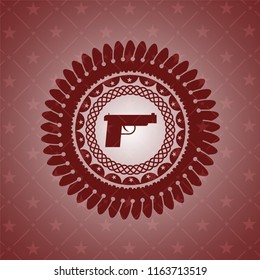 pistol icon inside red emblem