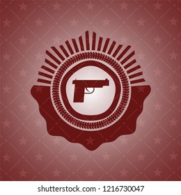 pistol icon inside red icon or emblem