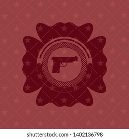 pistol icon inside red emblem