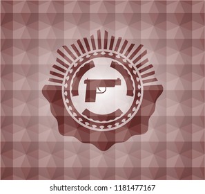 pistol icon inside red seamless badge with geometric pattern background.