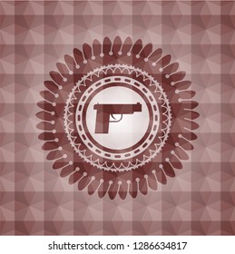 pistol icon inside red seamless geometric emblem.