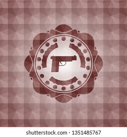pistol icon inside red seamless emblem or badge with geometric pattern background.
