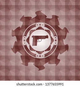 pistol icon inside red seamless emblem or badge with geometric pattern background.