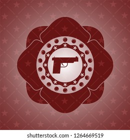 pistol icon inside retro red emblem