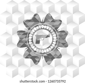 pistol icon inside retro style grey emblem with geometric cube white background