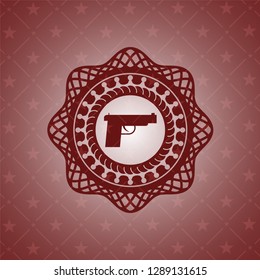 pistol icon inside retro style red emblem