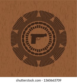 pistol icon inside retro style wood emblem