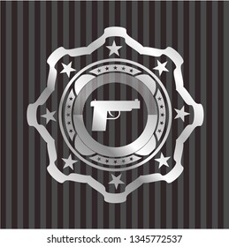 pistol icon inside silver badge