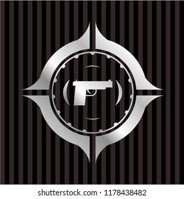 pistol icon inside silver emblem