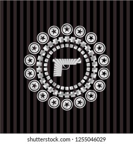 pistol icon inside silver emblem