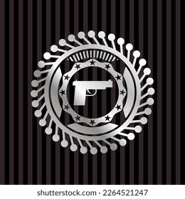 pistol icon inside silver emblem. 