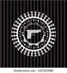 pistol icon inside silver shiny badge