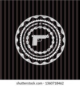 pistol icon inside silver shiny badge