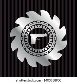 pistol icon inside silver shiny badge