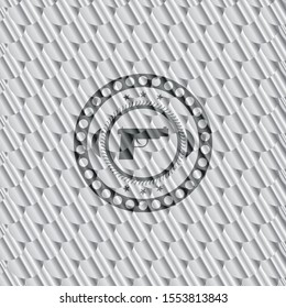 pistol icon inside silver shiny emblem. Scales pattern. Vector Illustration. Detailed.