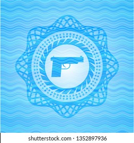 pistol icon inside sky blue water wave style badge.