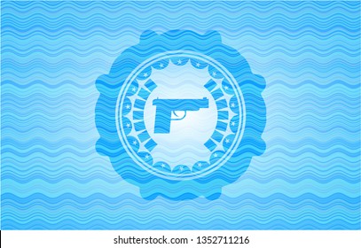 pistol icon inside water concept emblem background.