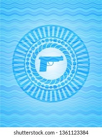 pistol icon inside water concept emblem.