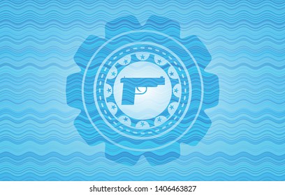 pistol icon inside water wave representation badge.
