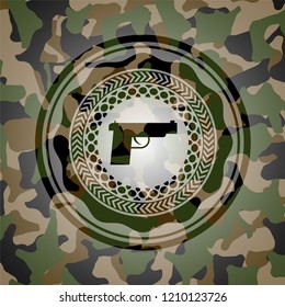 pistol icon on camo texture