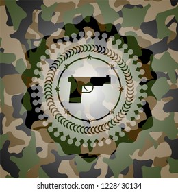 pistol icon on camo texture