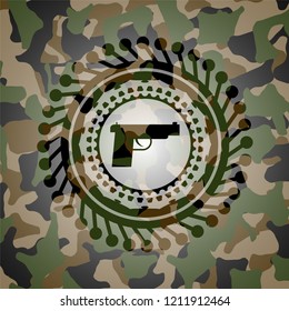 pistol icon on camouflaged pattern
