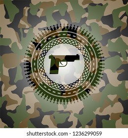 pistol icon on camouflaged texture