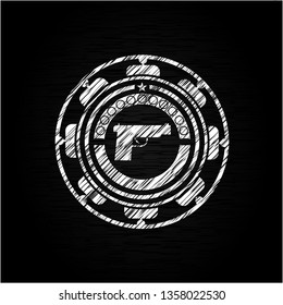 pistol icon on chalkboard