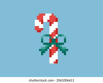 Pixel art candy cane Christmas illustration. 8 bit video game decoration with red and white candy cane Christmas candy and green ribbon. Vector isolated vintage icon.
