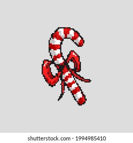 Pixel art candy cane isolated from background. Christmas traditional candy.
