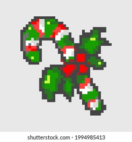 Pixel art candy cane isolated from background. Christmas traditional candy.