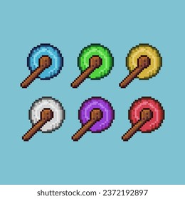 Pixel art sets of wizard staff with variation color item asset. Simple bits of magic wand weapon on pixelated style. 8bits perfect for game asset or design asset element for your game design asset.