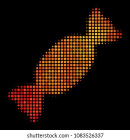 Pixel candy icon. Bright pictogram in fire color tinges on a black background. Vector halftone collage of candy symbol combined of round pixels.