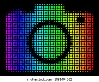 Pixel colorful halftone photo camera icon drawn with spectrum color variations with horizontal gradient on a black background.