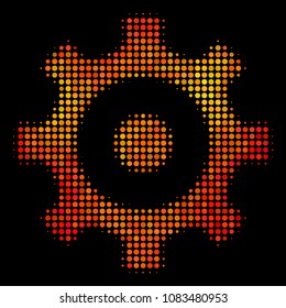 Pixelated gear icon. Bright pictogram in orange color variations on a black background. Vector halftone collage of gear icon designed from spheric elements.