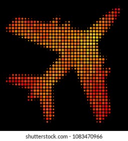 Pixelated jet plane icon. Bright pictogram in orange color tinges on a black background. Vector halftone composition of jet plane pictogram constructed of circle elements.