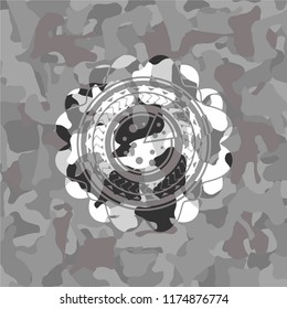 pizza icon inside grey camouflaged emblem