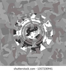 pizza icon inside grey camouflaged emblem