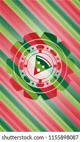 pizza slice icon inside christmas colors badge.