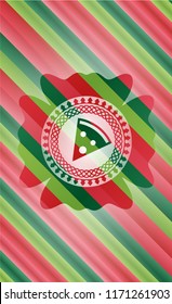 pizza slice icon inside christmas colors badge.