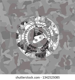 pizza slice icon inside grey camouflage emblem
