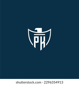 PK initial monogram logo for shield with eagle image vector design